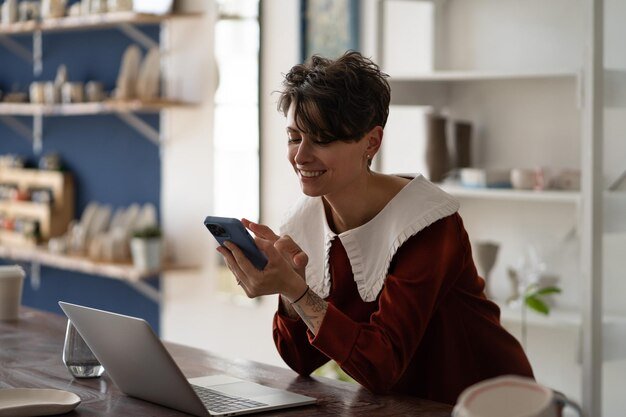 Indian small business owner using smartphone showing need for professional website